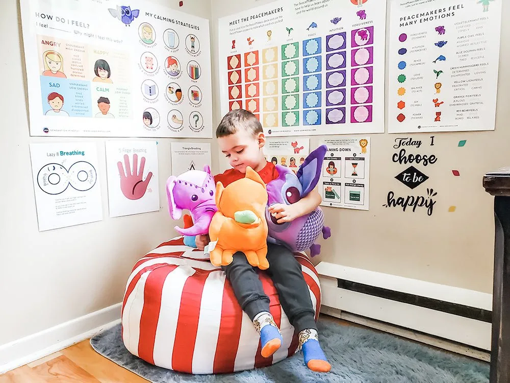 3 year-old in calm down corner with snugglebuddies from generation mindful. 